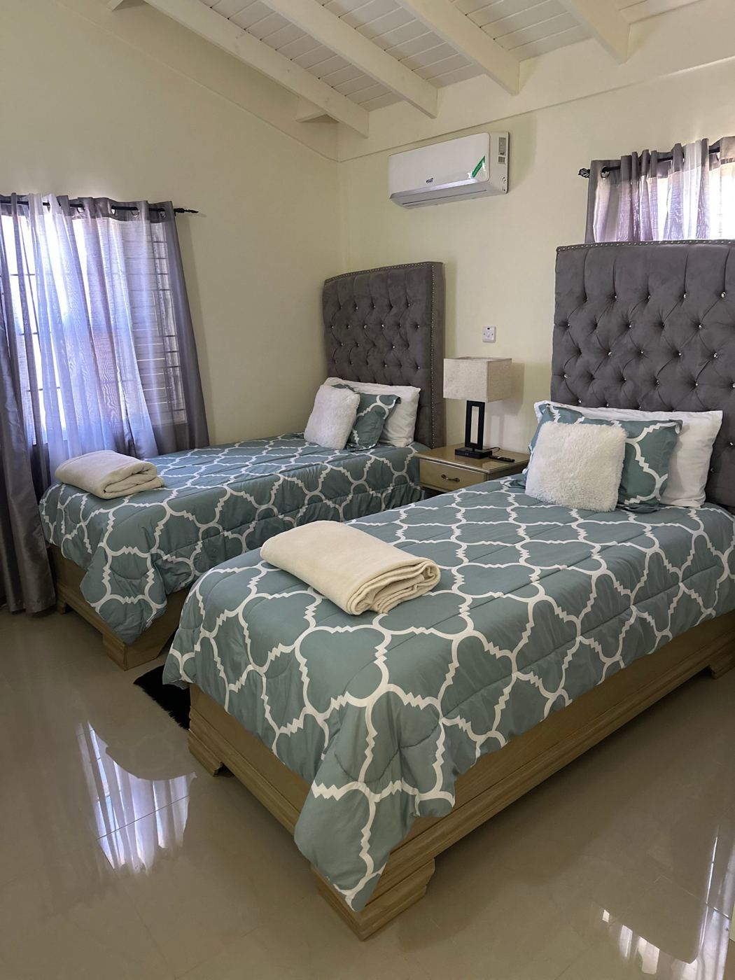 Second bedroom with two twin beds in teal bedding